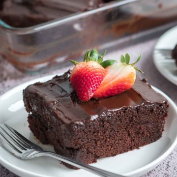 slice chocolate cake with strawberry on top