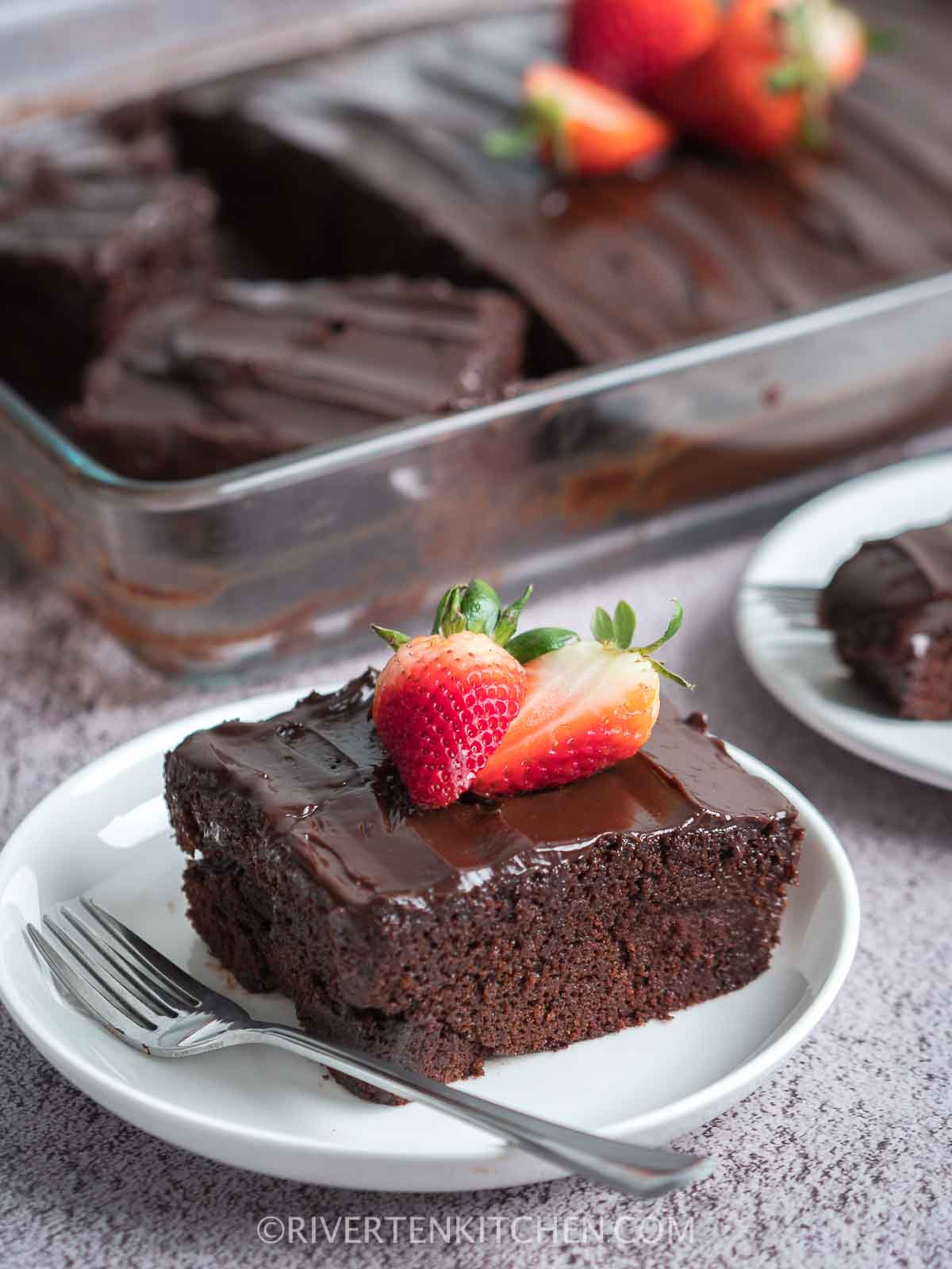 chocolate cake with frosting and strawberries