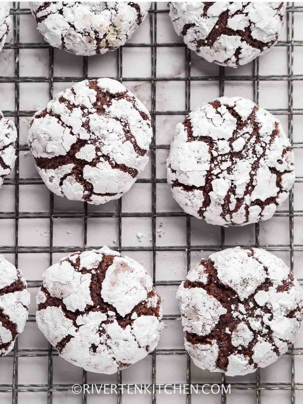 chocolate cookies covered with icing sugar