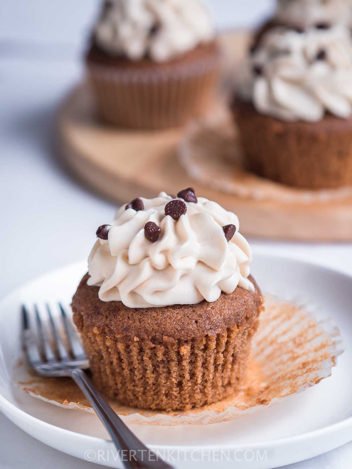 mocha flavored cupcakes with whipped cream frosting and chocolate chips